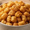 Crunchy roasted jowar pops in a ceramic bowl