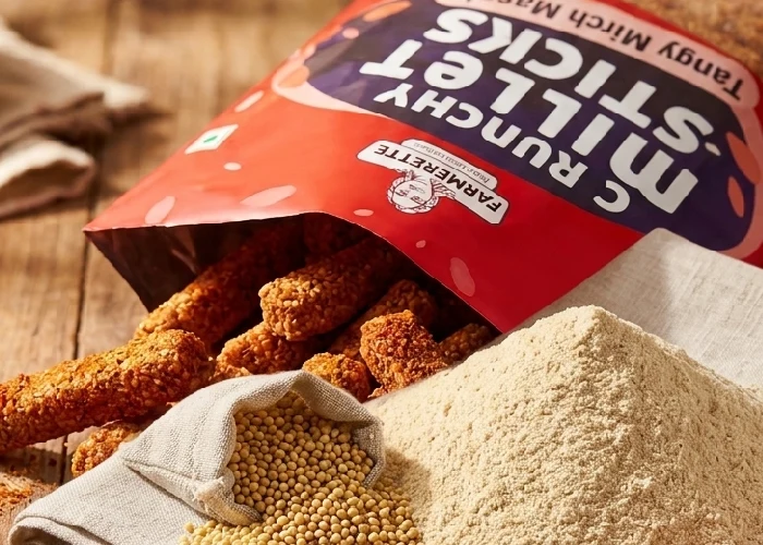 Raw millet grain and millet flour used for healthy snacking.