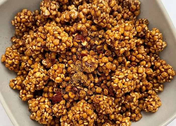 A bowl of roasted popped millets seasoned with spices.
