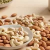 Fresh whole almonds and cashews showcasing the nutritional benefits of nuts used in a healthy snack bar.