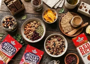 Collection of the best organic snacks without artificial preservatives placed on a wooden table.