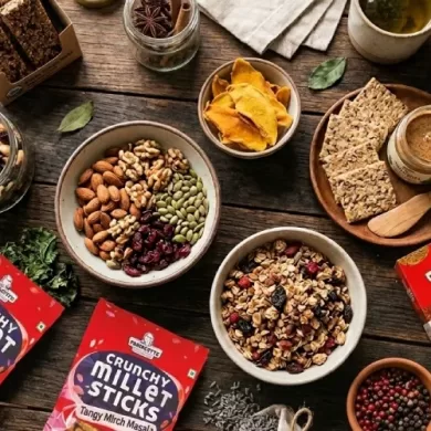 Collection of the best organic snacks without artificial preservatives placed on a wooden table.